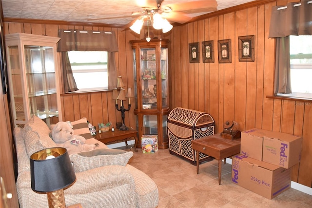423 Longfellow Blvd, Lakeland, FL 33801 - living area with wooden walls, ceiling fan, crown molding, and tile patterned flooring
