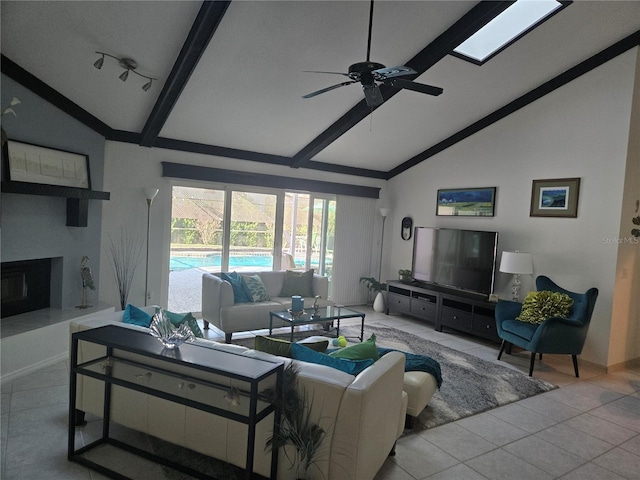 tiled living room featuring beamed ceiling, ceiling fan, and high vaulted ceiling