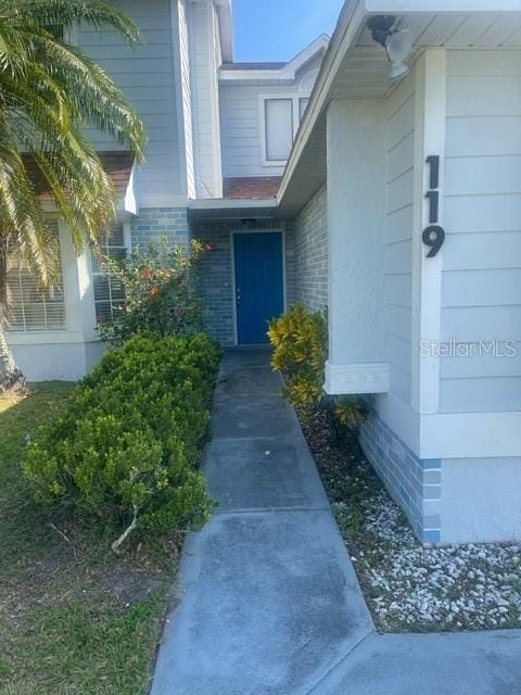 entrance to property with brick siding