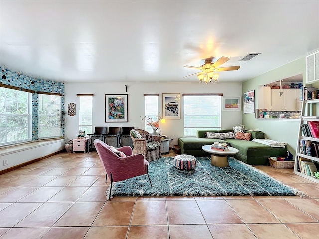 tiled living room featuring ceiling fan