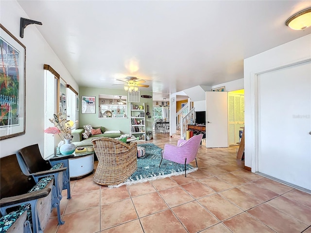 tiled living room featuring ceiling fan