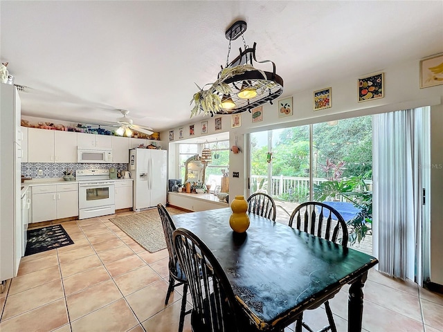 dining area featuring light tile patterned floors and ceiling fan