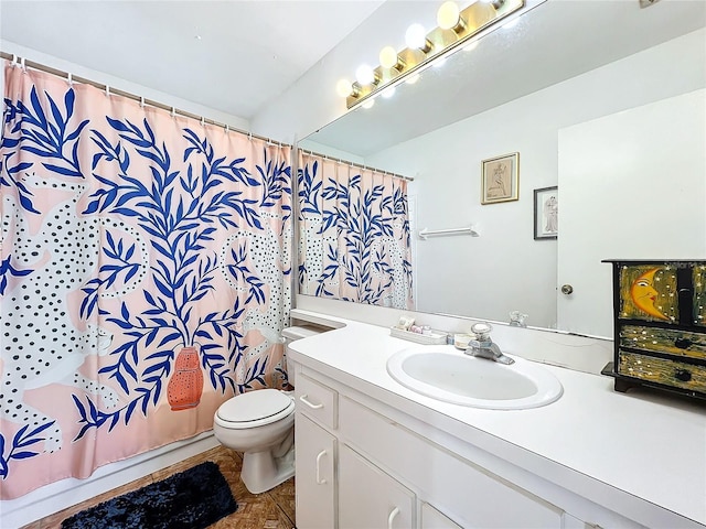 full bathroom with vanity, shower / bath combo, and toilet