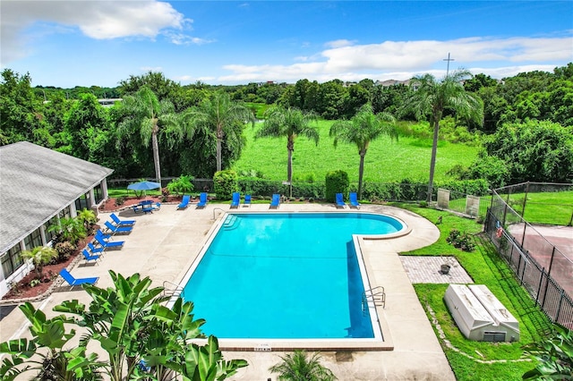 view of swimming pool with a patio