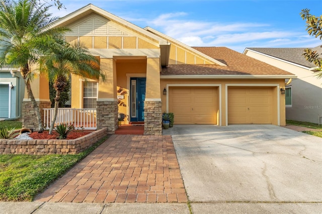 view of front of house with a garage and a porch