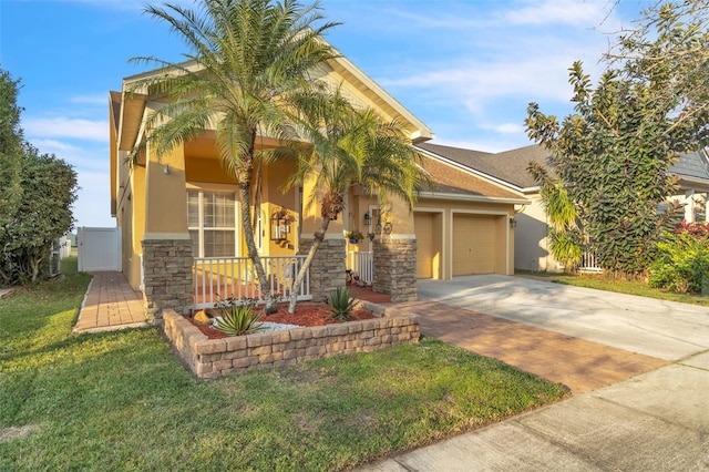 view of front of property with a porch, a garage, and a front yard