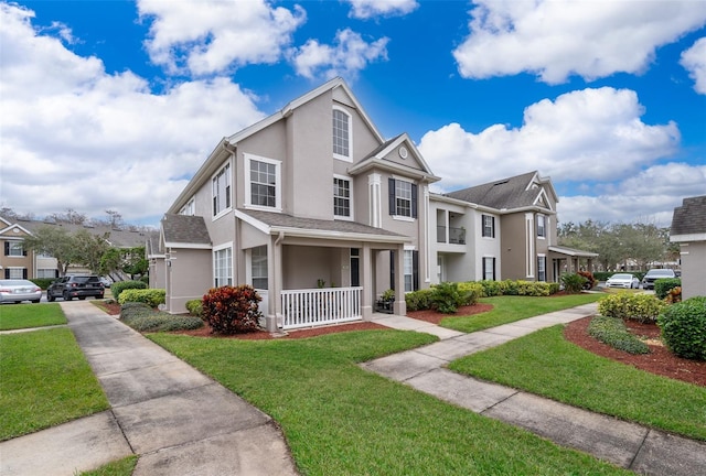 view of front of house featuring a porch and a front yard