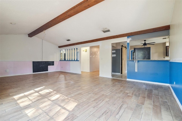 unfurnished living room with hardwood / wood-style flooring, ceiling fan, a barn door, and vaulted ceiling with beams