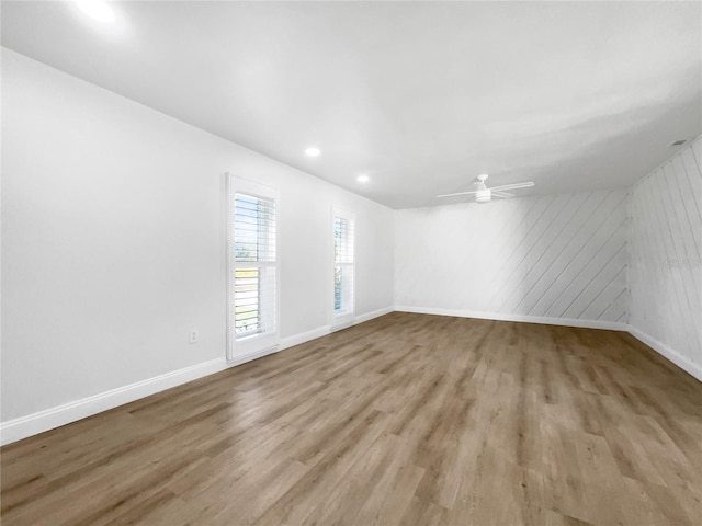 spare room featuring ceiling fan and light wood-type flooring