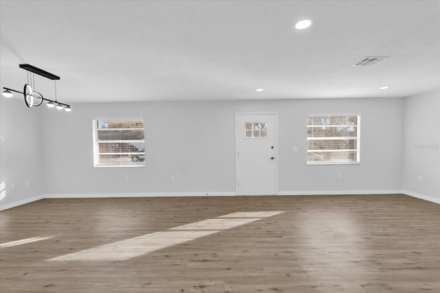 empty room featuring wood-type flooring