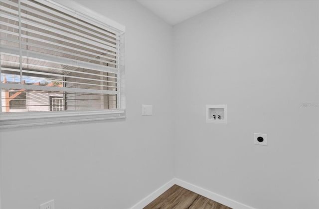 laundry area with hookup for an electric dryer, hookup for a washing machine, and hardwood / wood-style floors