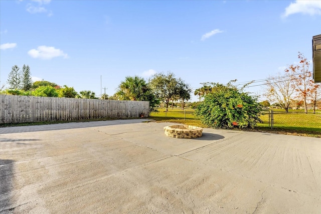 view of patio / terrace featuring an outdoor fire pit