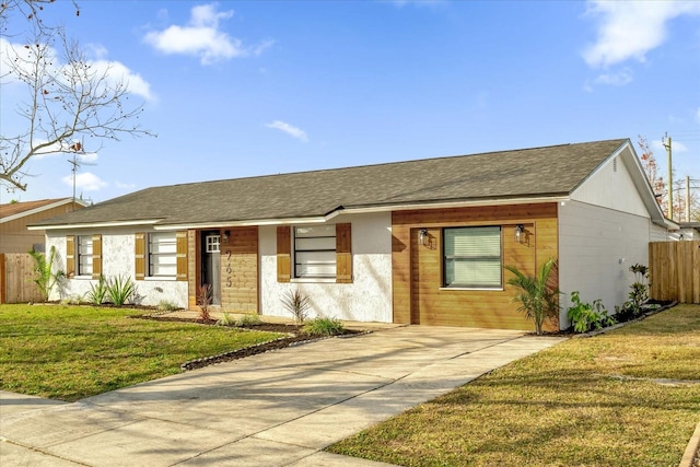 single story home with a front lawn