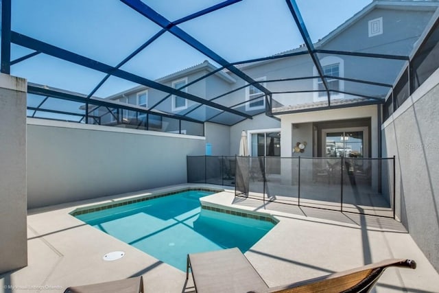 view of pool featuring a lanai and a patio