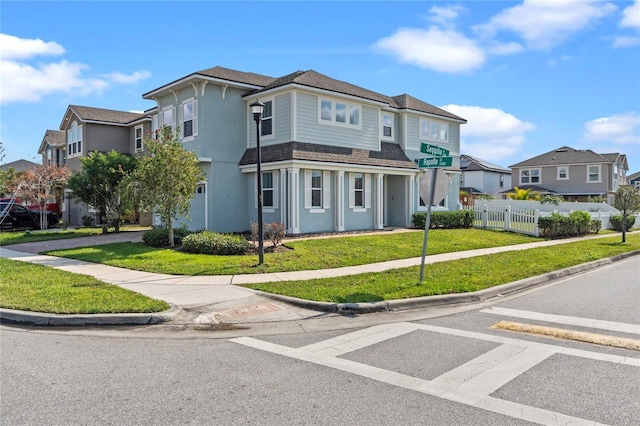 view of front of house featuring a front lawn