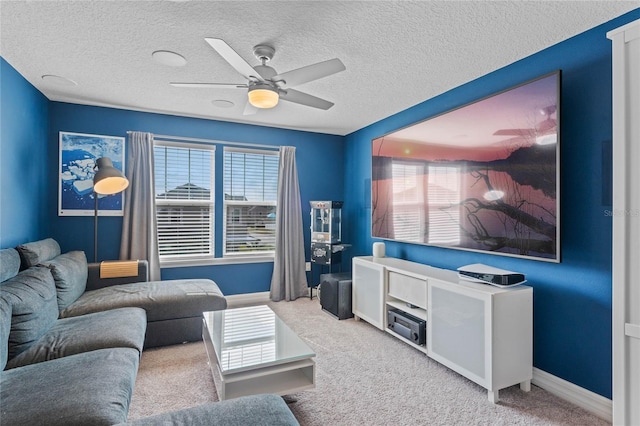 carpeted living room featuring ceiling fan, a healthy amount of sunlight, and a textured ceiling