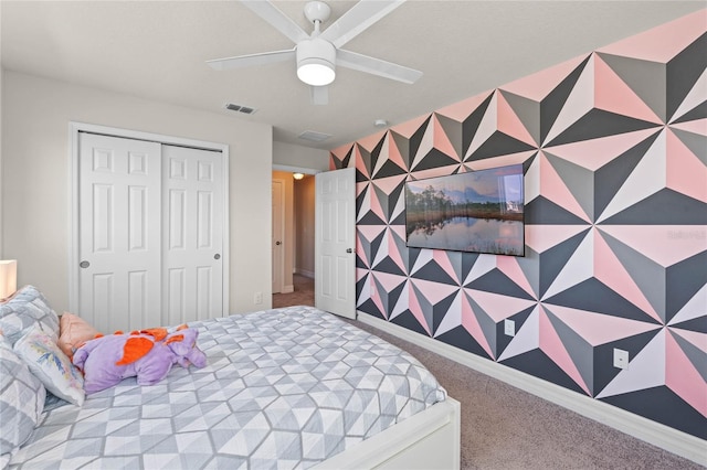 bedroom featuring a closet, ceiling fan, and carpet flooring