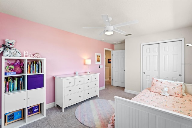 carpeted bedroom with a closet and ceiling fan