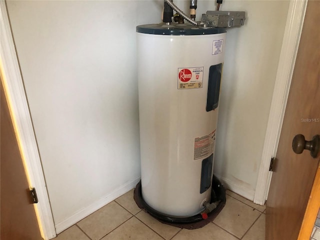 utility room featuring electric water heater