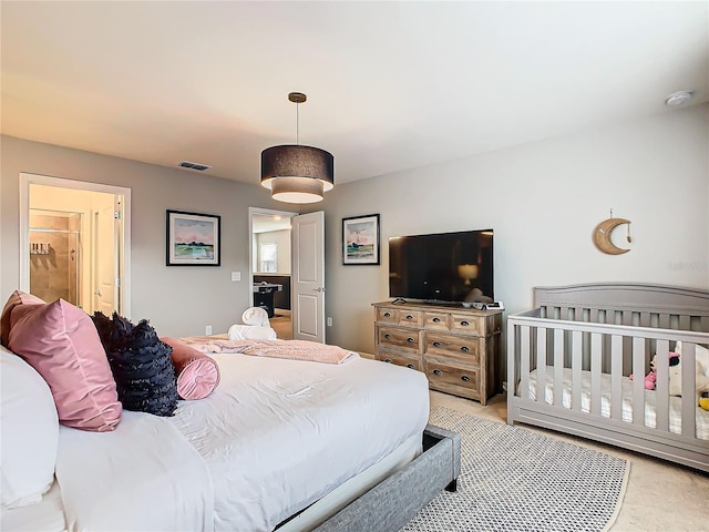 bedroom featuring light carpet