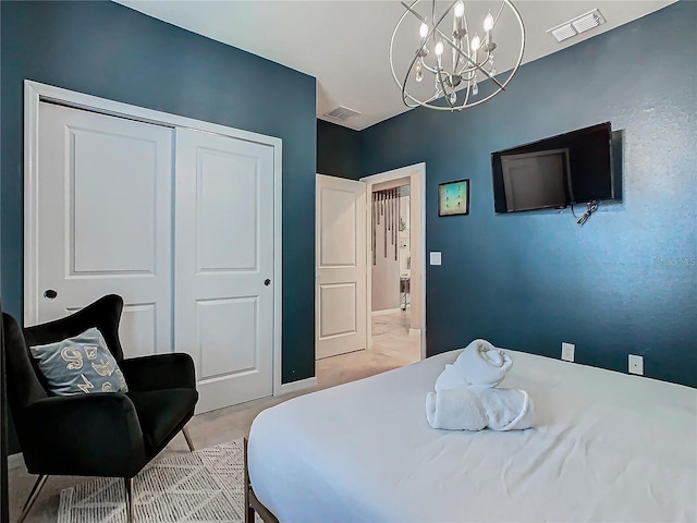 bedroom featuring a notable chandelier and a closet