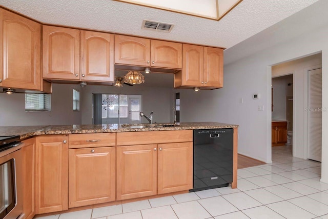 kitchen featuring a textured ceiling, stove, a sink, visible vents, and dishwasher