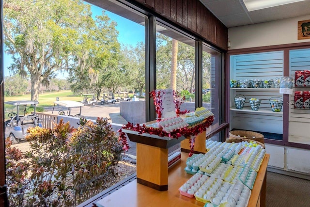 sunroom featuring a drop ceiling