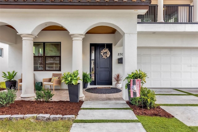 doorway to property with a garage