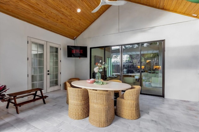 dining room featuring wood ceiling, high vaulted ceiling, french doors, and ceiling fan