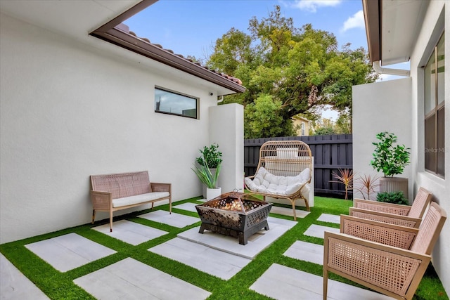 view of patio / terrace with a fire pit