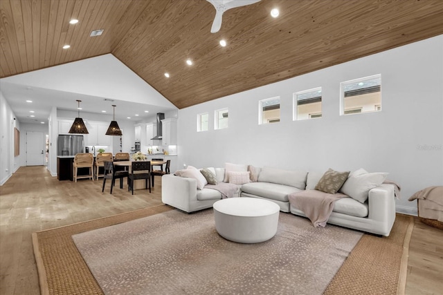 living room with high vaulted ceiling, light hardwood / wood-style flooring, wooden ceiling, and ceiling fan