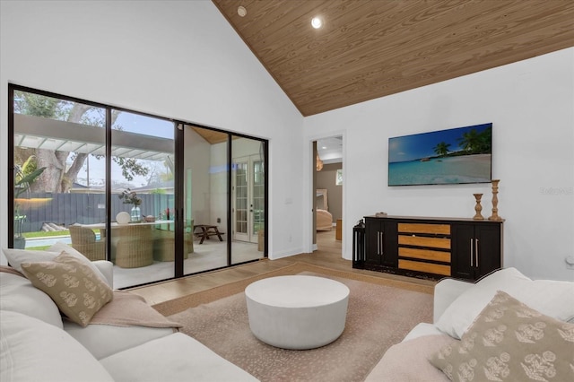 living room with wood ceiling, high vaulted ceiling, and light wood-type flooring