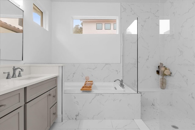 bathroom featuring vanity and separate shower and tub