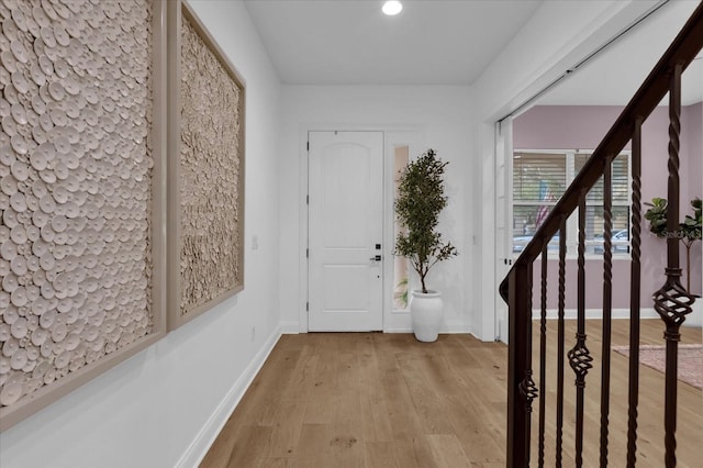 entrance foyer with light hardwood / wood-style flooring