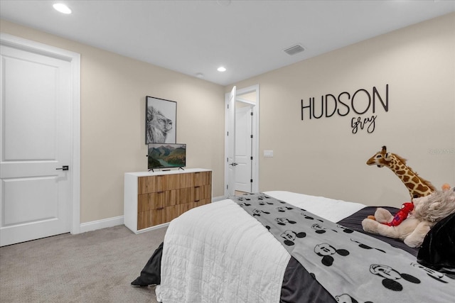 bedroom featuring light colored carpet