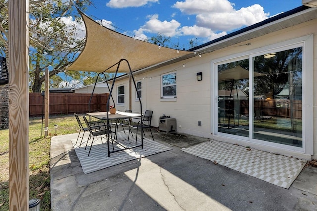 view of patio / terrace featuring outdoor dining area and fence