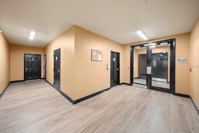 corridor featuring light wood-type flooring