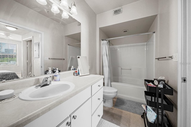 full bathroom featuring vanity, shower / bath combo, tile patterned floors, and toilet