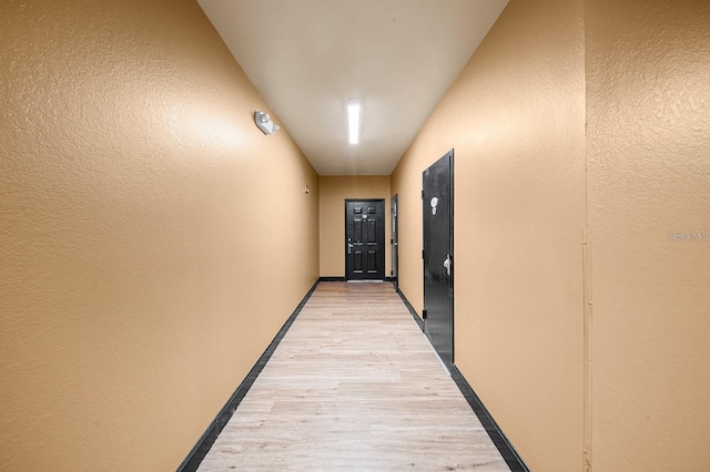 hallway featuring light wood-type flooring