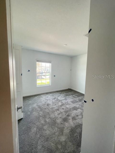 1148 Pomelo St, Davenport, FL 33837 - view of carpeted spare room