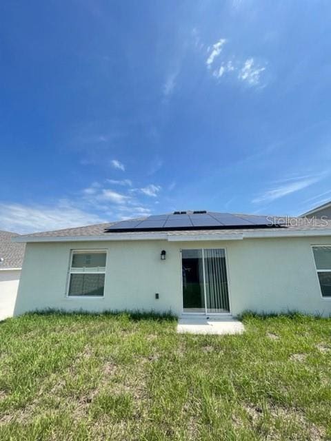 1148 Pomelo St, Davenport, FL 33837 - back of property with a yard
