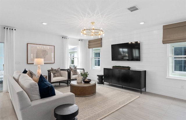 living room with a notable chandelier