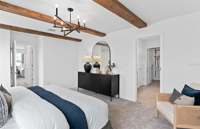 bedroom with an inviting chandelier, light carpet, and beam ceiling