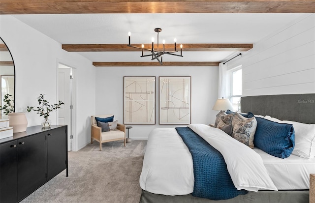 bedroom featuring carpet floors, an inviting chandelier, and beam ceiling