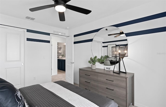 bedroom featuring light colored carpet and ceiling fan