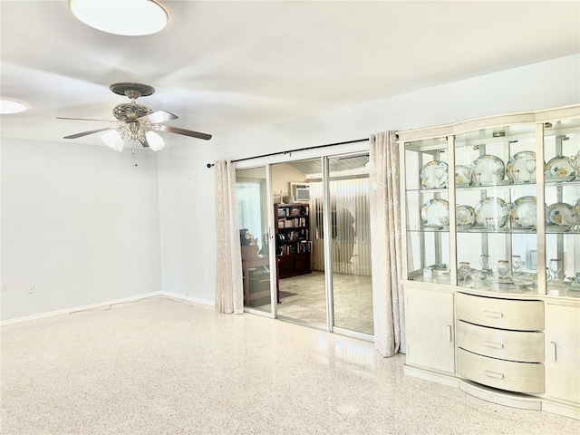 unfurnished room featuring ceiling fan