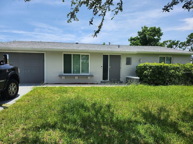 single story home with a garage and a front yard