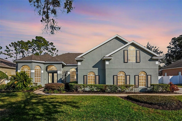 view of front of house with a lawn