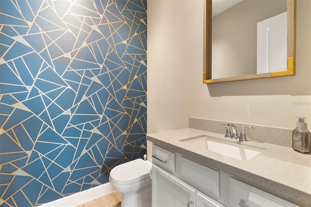 bathroom with vanity and toilet