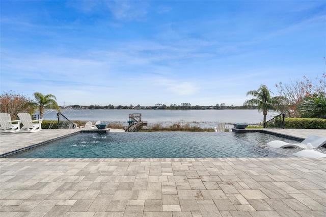 view of swimming pool featuring a water view, pool water feature, and a patio area